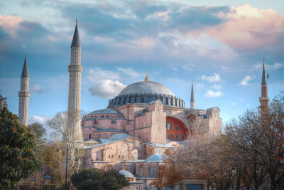 Low angle view of mosque against sky