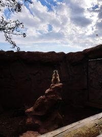 Low angle view of statue against cloudy sky