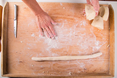 High angle view of woman preparing food on table