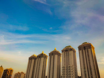 Low angle view of modern buildings against sky