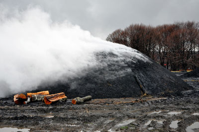 Charcoal pile burning in the outdoors, romania