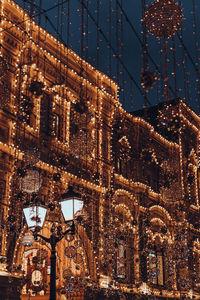 Low angle view of illuminated buildings at night