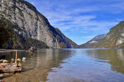 Scenic view of lake and mountains against sky