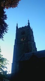 Low angle view of church against clear blue sky