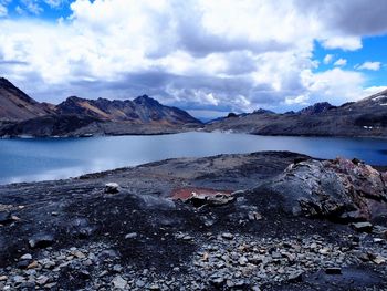 Scenic view of lake and mountains against sky