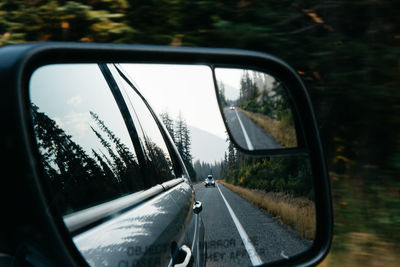 Reflection of car on side-view mirror