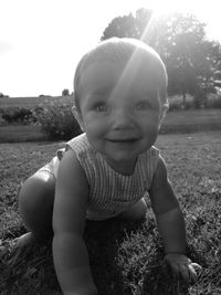 Portrait of cute smiling girl on field