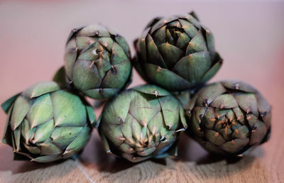 Close-up of artichokes on table