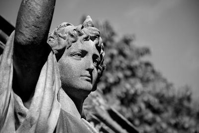 Close-up of statue against tree