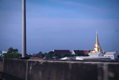 Illuminated building against sky at dusk