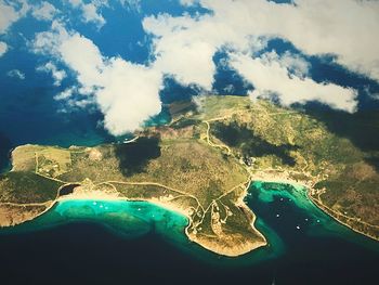 Aerial view of lake against cloudy sky