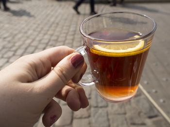 Close-up of hand holding drink