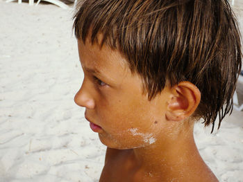 Close-up portrait of shirtless boy