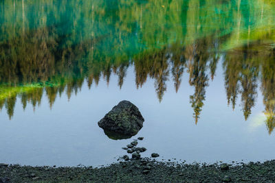 Reflection of rocks in lake water