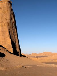 Rock formations in desert against clear sky