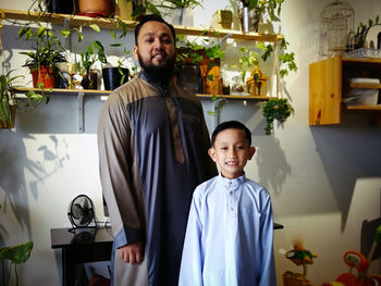 Portrait of man with son wearing kurta