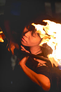 Bonfire in front of wall in darkroom