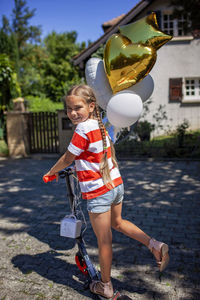 Rear view of woman standing on street