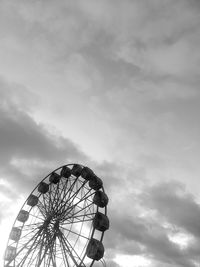 Low angle view of ferris wheel against sky