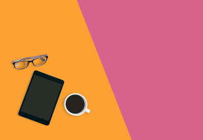 Information sign on table against orange background