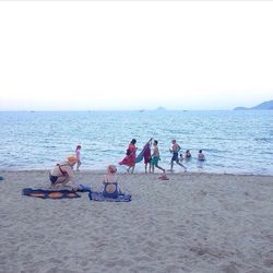 View of people enjoying at beach