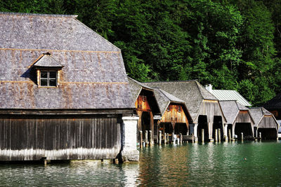 Houses by lake against building