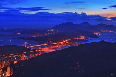 Aerial view of illuminated city at night