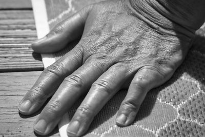 Close-up of woman hands on table