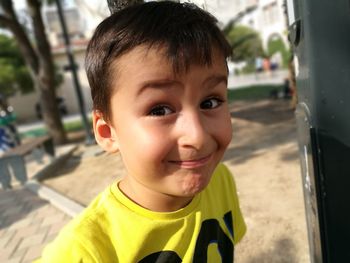 Close-up portrait of boy at park