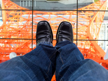 Low section of man standing on floor