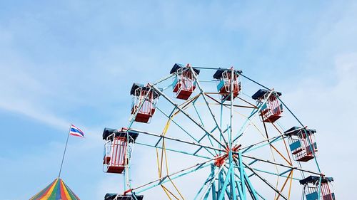 Low angle view of ferris wheel against sky