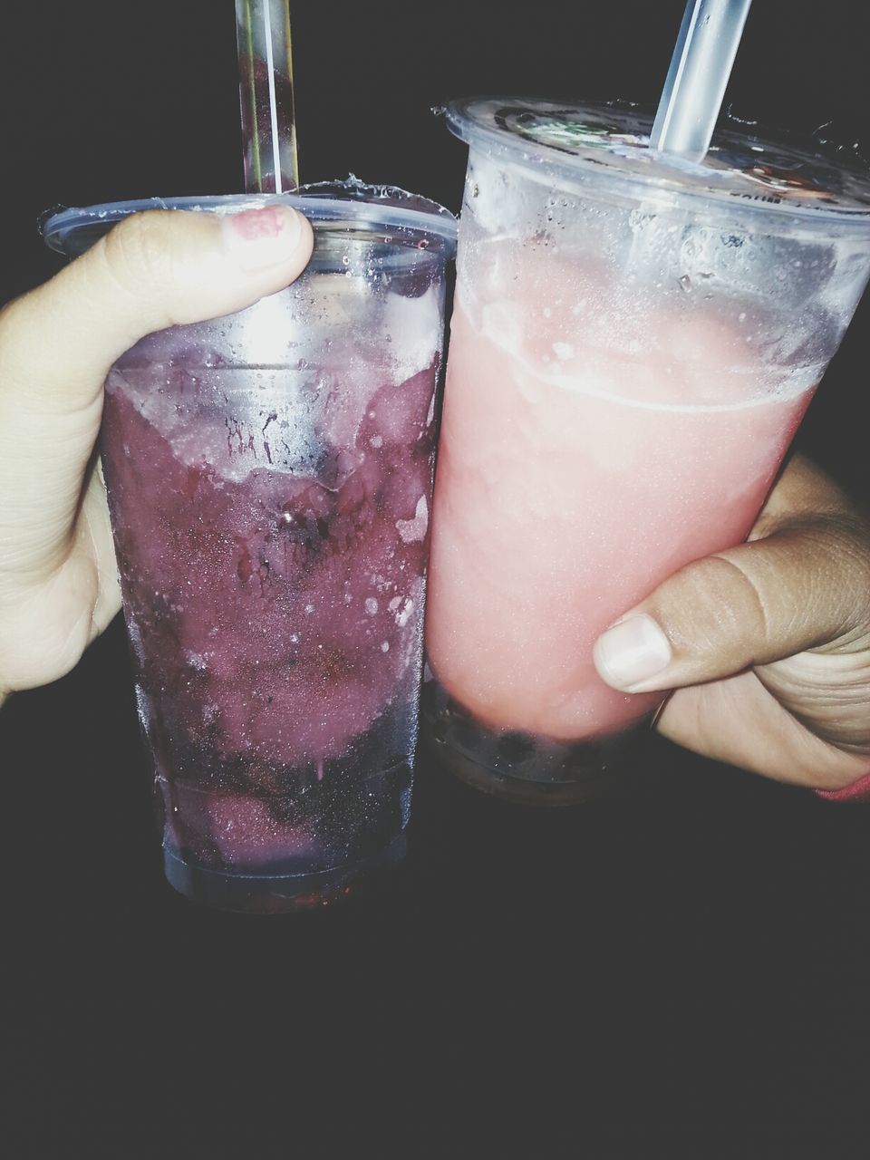 food and drink, drink, drinking glass, refreshment, person, freshness, indoors, glass - material, close-up, alcohol, part of, table, glass, holding, cropped, ice cube, transparent