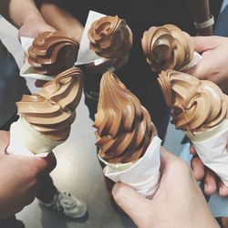 Midsection of man holding ice cream