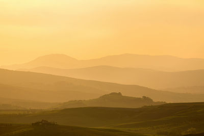 Sunset over a rolling landscape