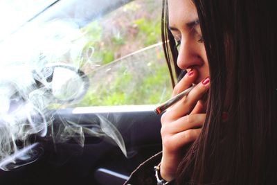 Portrait of woman in car