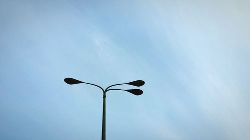 Low angle view of street light against sky