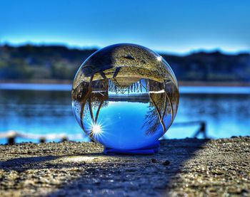 Close-up of crystal ball on water