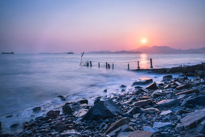 Scenic view of sea against sky during sunset