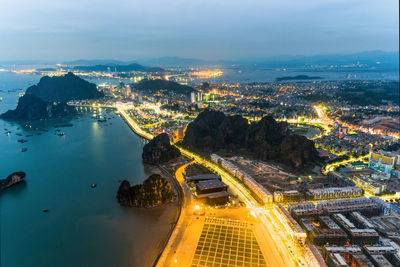 Aerial view of illuminated city at night