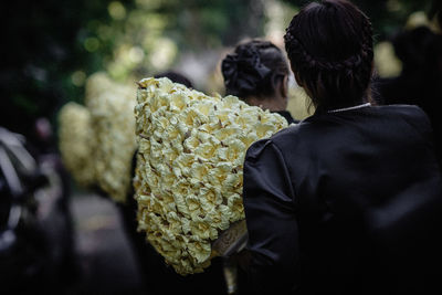 Rear view of people on road