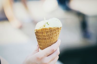 Close-up of person holding ice cream cone