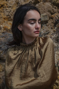 Portrait of young woman looking away