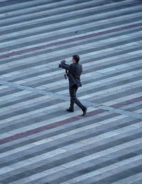 Full length of a man photographing