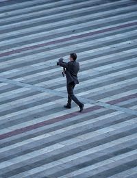 Businessman walking on road