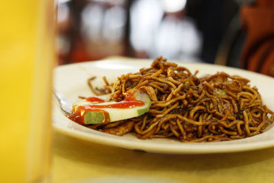 Close-up of noodles served in plate