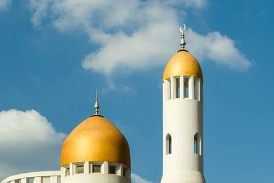 Low angle view of mosque minaret tower against sky
