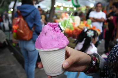 Midsection of woman holding ice cream