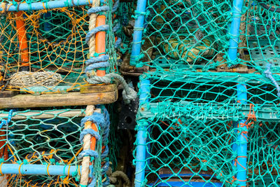 Close-up of fishing net at harbor