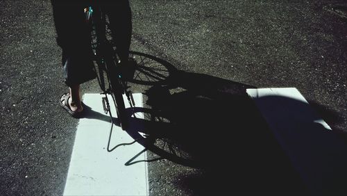 Low section of people standing on tiled floor