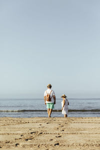 Senior couple on the beach, el roc de sant gaieta, spain